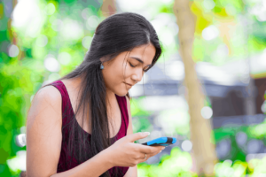 Woman checking social media on her smartphone